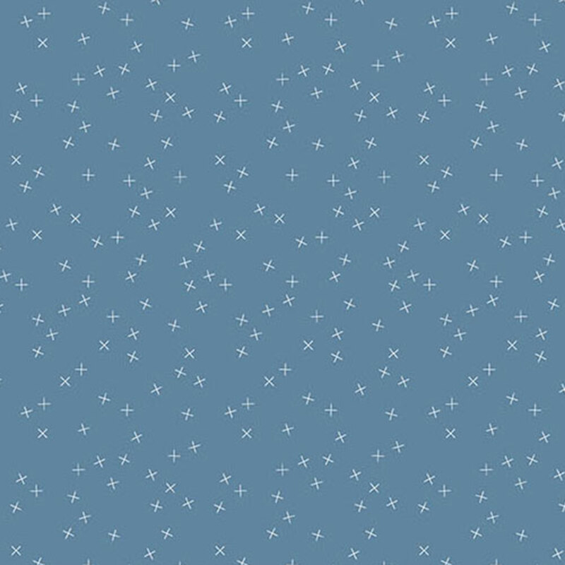 Medium blue fabric with small white X's scattered throughout