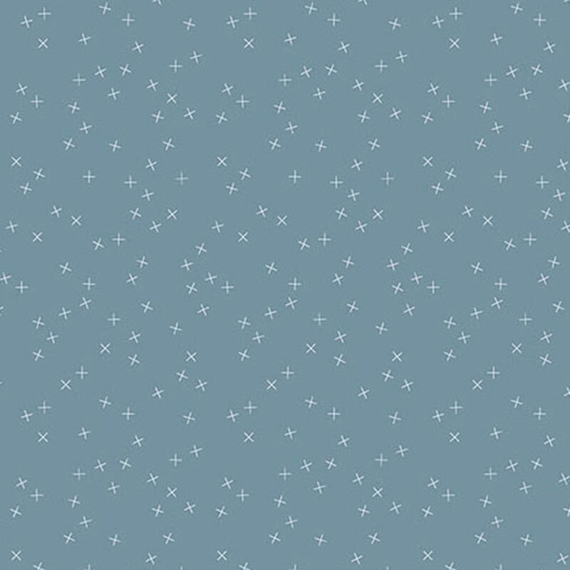 A medium blue fabric with small white X's scattered throughout