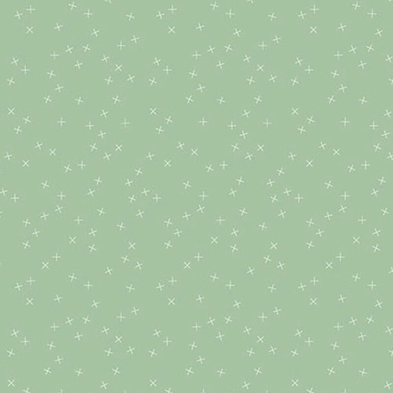 Mint green fabric with small white X's scattered throughout