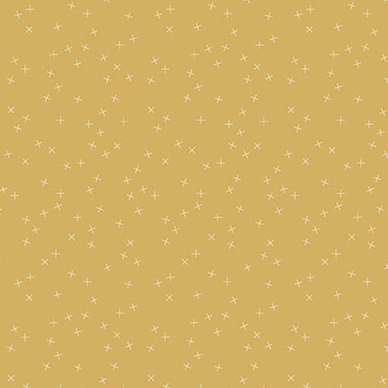 Golden brown fabric with small white X's scattered throughout