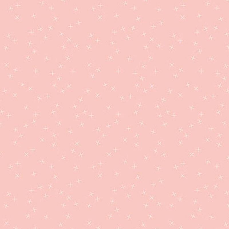 Light pink fabric with small white X's scattered throughout