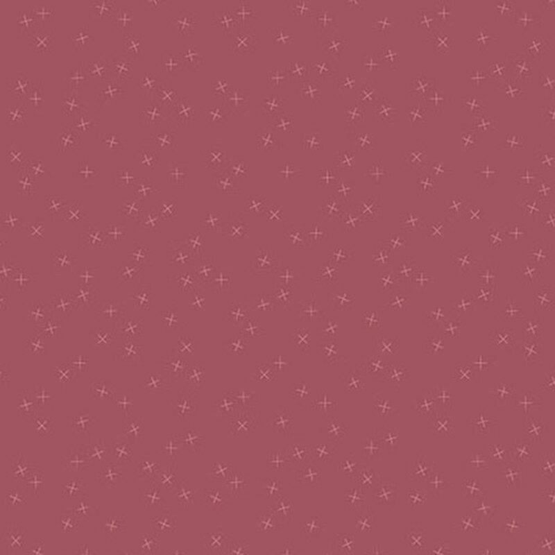 Medium rose red fabric with tonal light red X's scattered all over