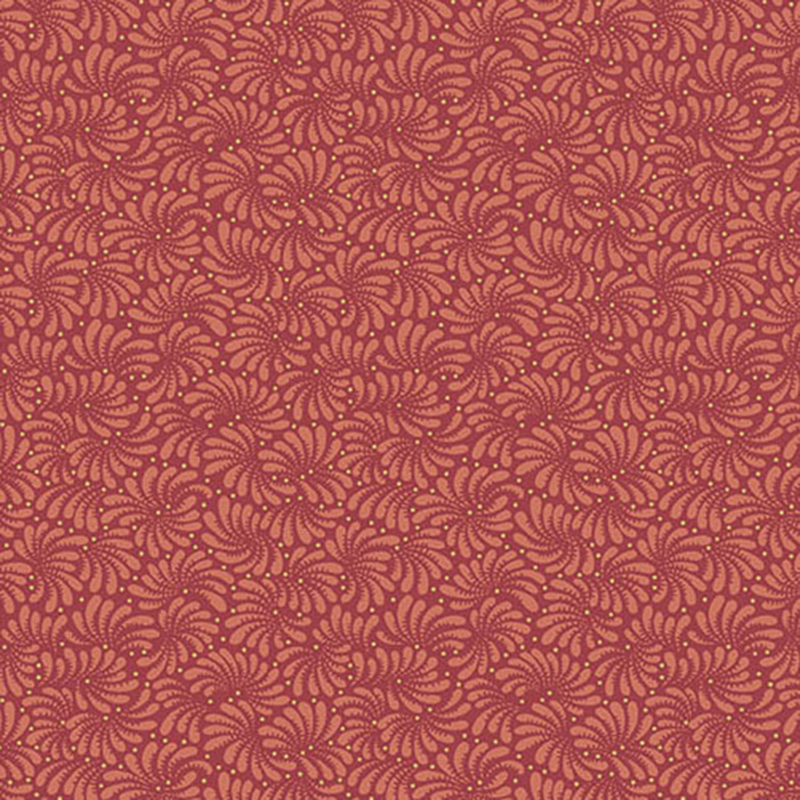 Tonal red fabric with a repeating intricate swirled pattern throughout