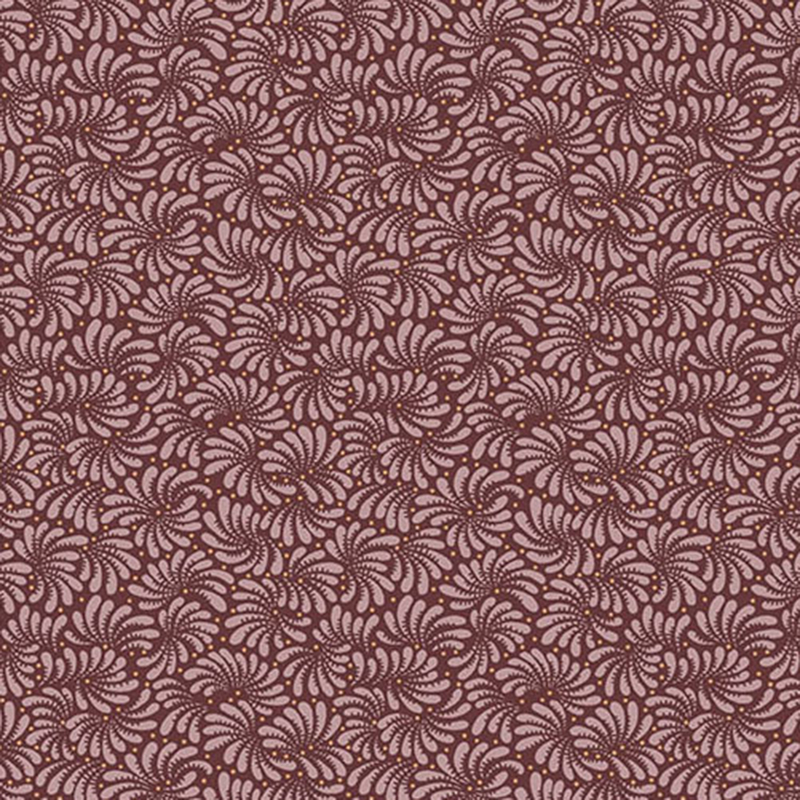 Wine colored fabric with a repeating intricate swirled pattern throughout
