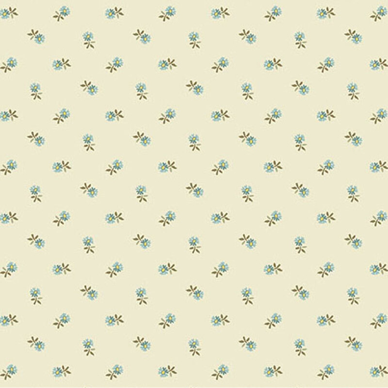 Cream colored fabric with a small, blue, ditsy floral pattern throughout