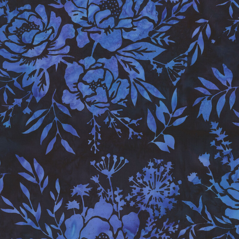 Dark blue-black batik fabric with indigo floral clusters.