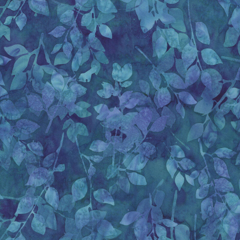 Dark aqua and purple mottled batik fabric with tonal outlines of leaves running across the fabric.