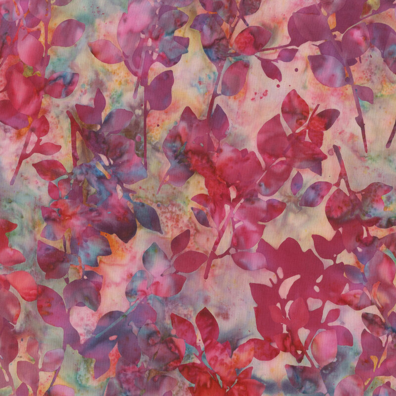 Multi-colored mottled batik fabric with dark pink leaves against a multi-color background.