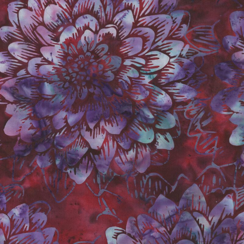 Dark red mottled batik fabric with large pale purple mottled florals.