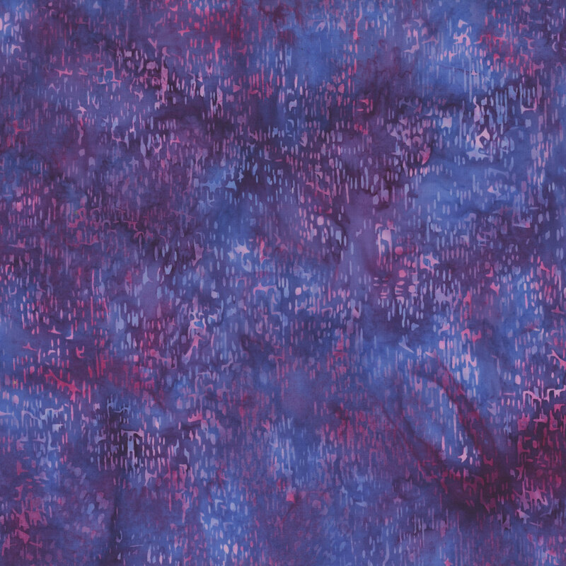 Purple and blue mottled fabric with a watercolor splatter effect