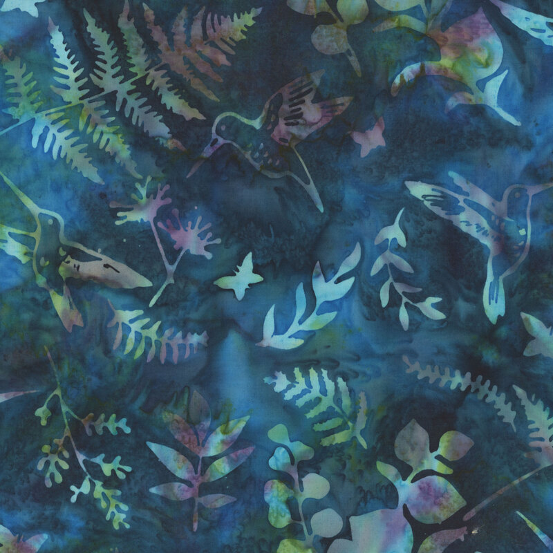 Dark blue and teal mottled batik fabric with various leafy sprigs and hummingbirds throughout.