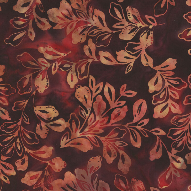 Dark red batik with peach leaf pattern.