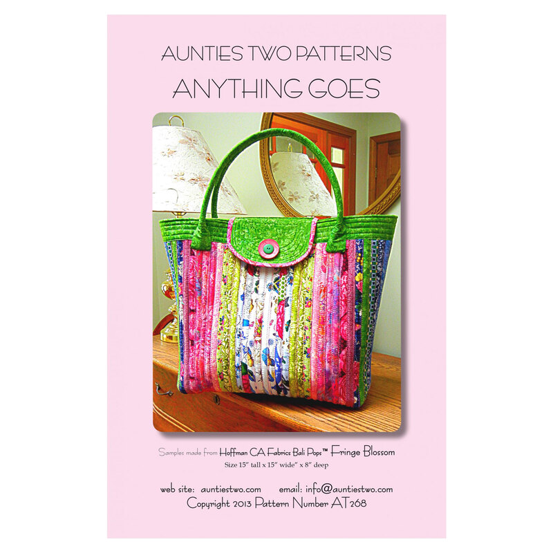 Front Cover of Anything Goes pattern by Aunties Two Patterns featuring the finished bag displayed on a table in front of a lamp and mirror
