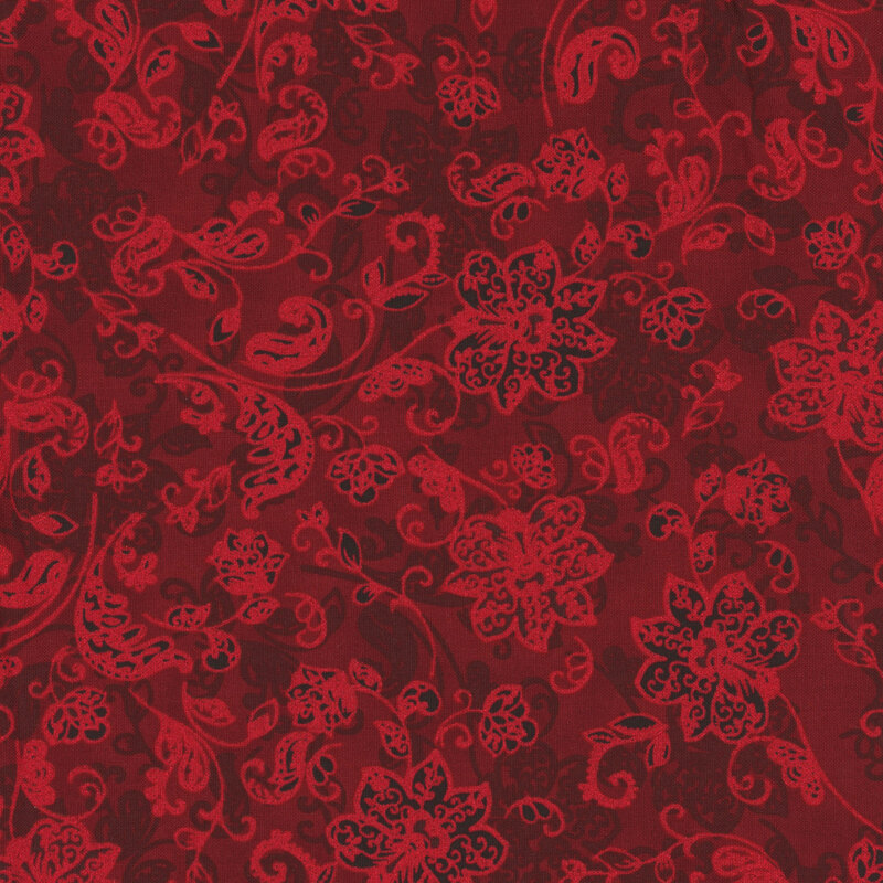 red fabric with tossed flowers and swirling leaves and stems