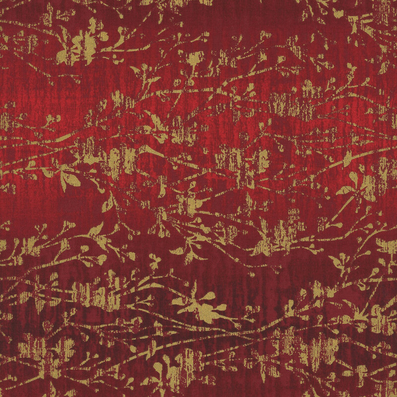 mottled red fabric with metallic gold branches stretching across the fabric and distressed vertical lines running through the print