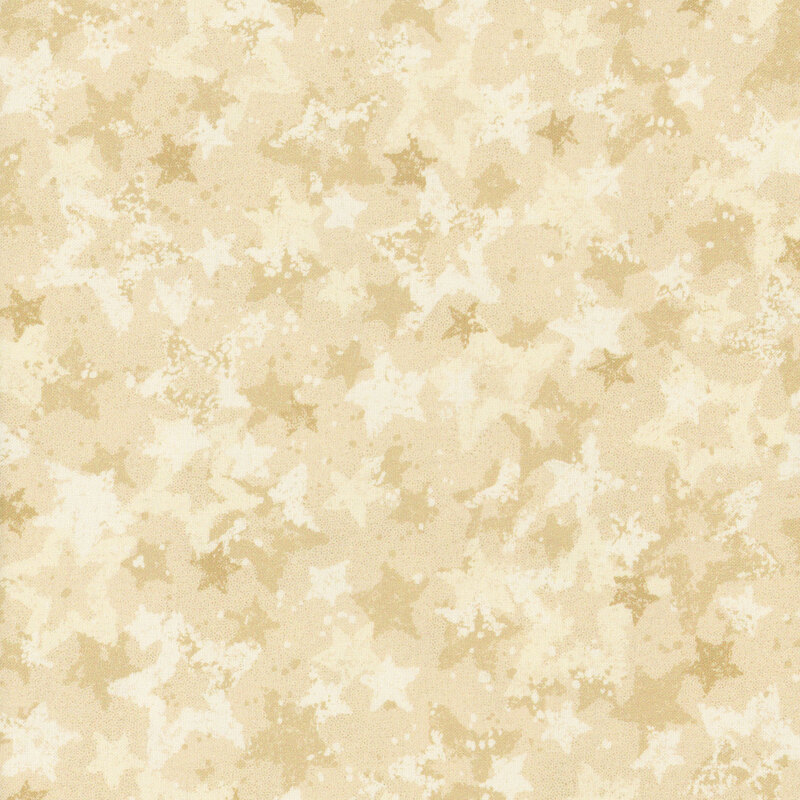 Swatch of cream fabric with tossed and layered tonal cream stars.