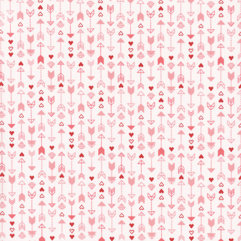 white fabric featuring a pattern of arrows, hearts and diamonds