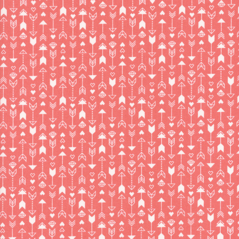 pink fabric featuring a pattern of arrows, hearts and diamonds