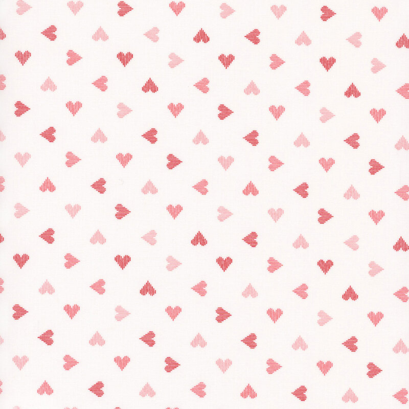 white fabric featuring ditsy hearts