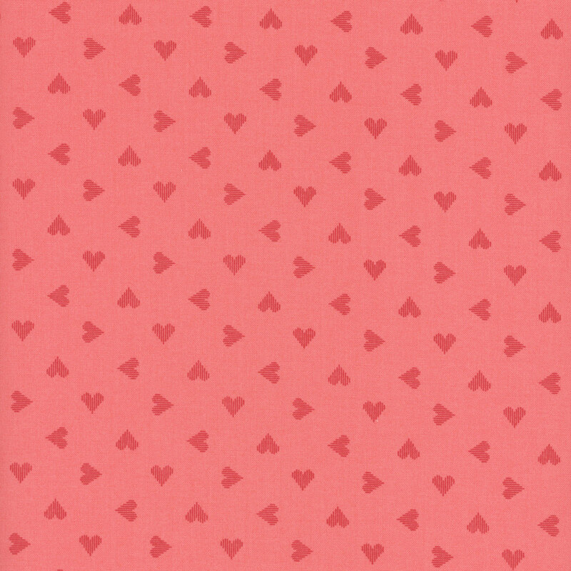 pink fabric featuring ditsy hearts