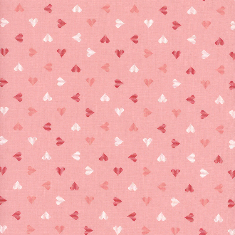 light pink fabric featuring ditsy hearts