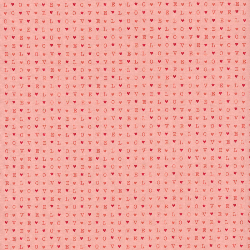 light pink fabric with a repeated pattern of the word love and hearts