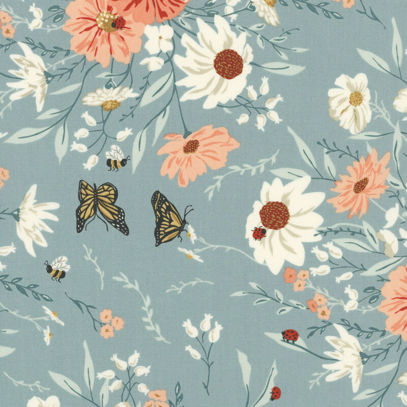 Blue fabric with a floral and farm bug pattern