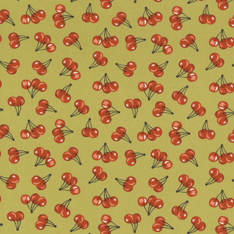 Green fabric with scattered cherry print pattern