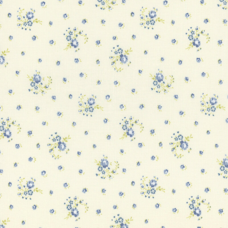 Cream fabric with a blue ditzy floral pattern 