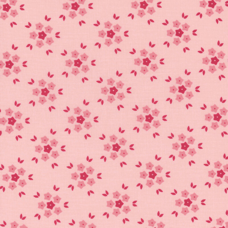 Pink fabric with a red geometric floral pattern