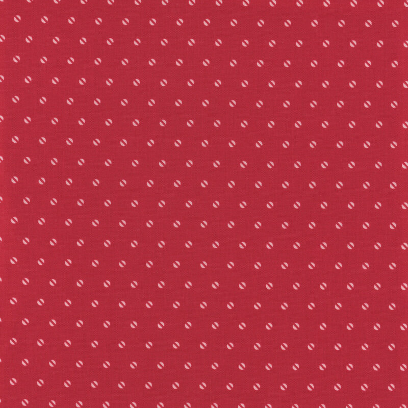 Red fabric with a light pink half circle dot pattern