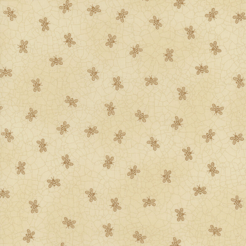 Tonal pale tan fabric with a cracked earth texture and ditsy buzzing bees throughout