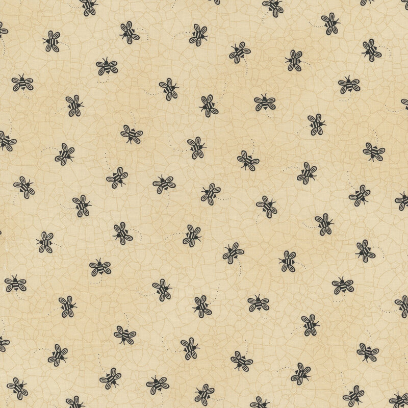 Pale tan fabric with a cracked earth texture and black, ditsy bumblebees throughout