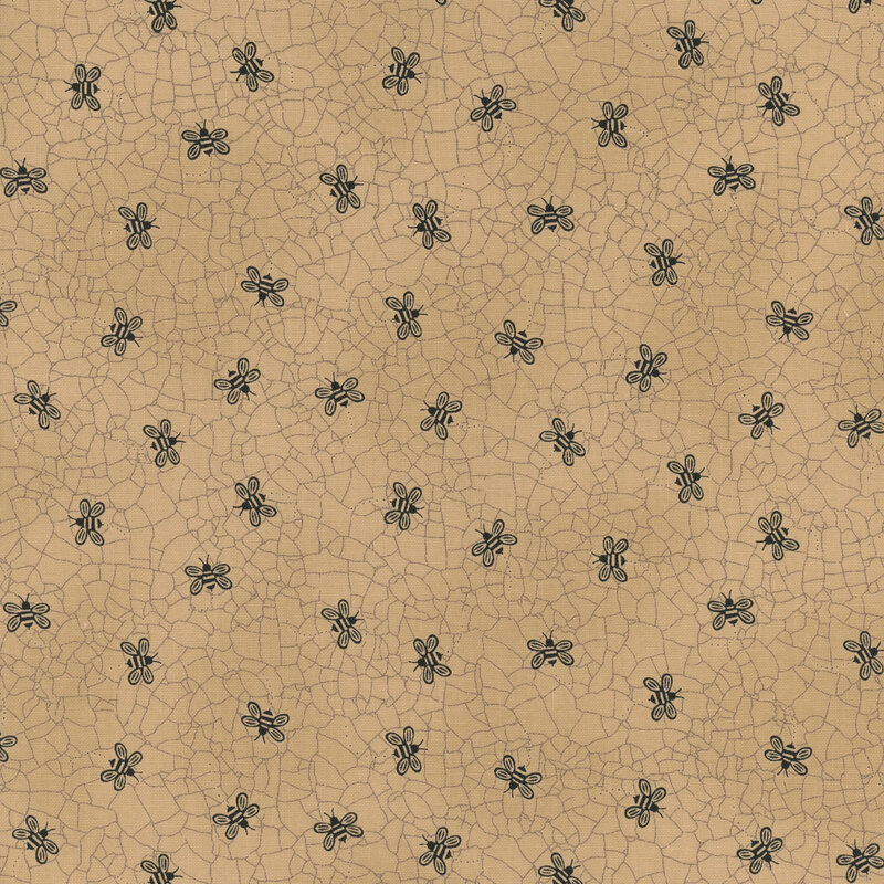 Tan fabric with a cracked earth texture and black, ditsy bumblebees throughout