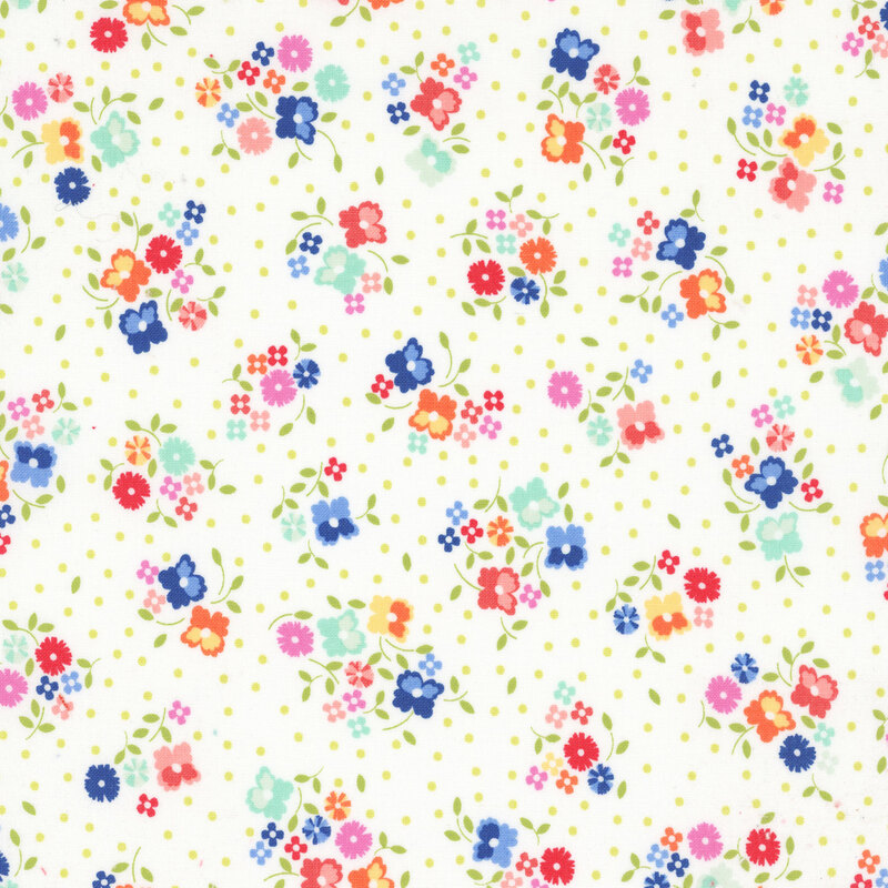 White fabric with small, colorful ditsy floral clusters and little green dots throughout