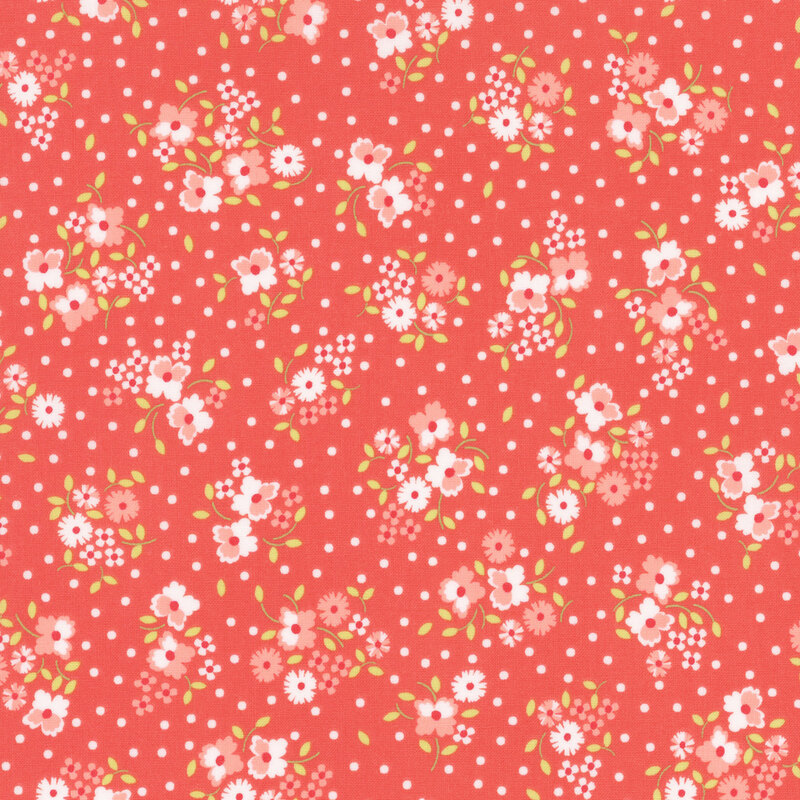 Reddish pink fabric with small, colorful ditsy floral clusters and little white dots throughout