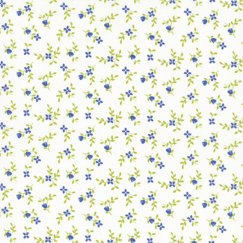 White fabric with ditsy blue flowers and green sprigs throughout