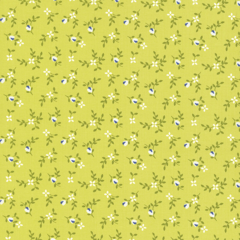 Lime green fabric with ditsy white flowers and green sprigs throughout