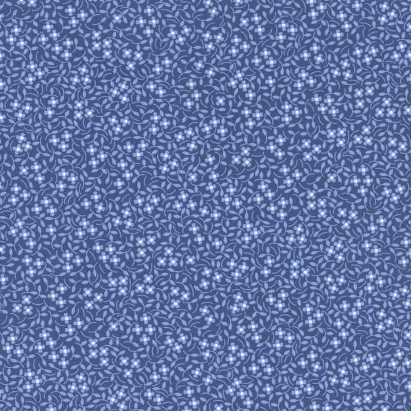 Blue fabric with little white flowers and in a calico pattern throughout