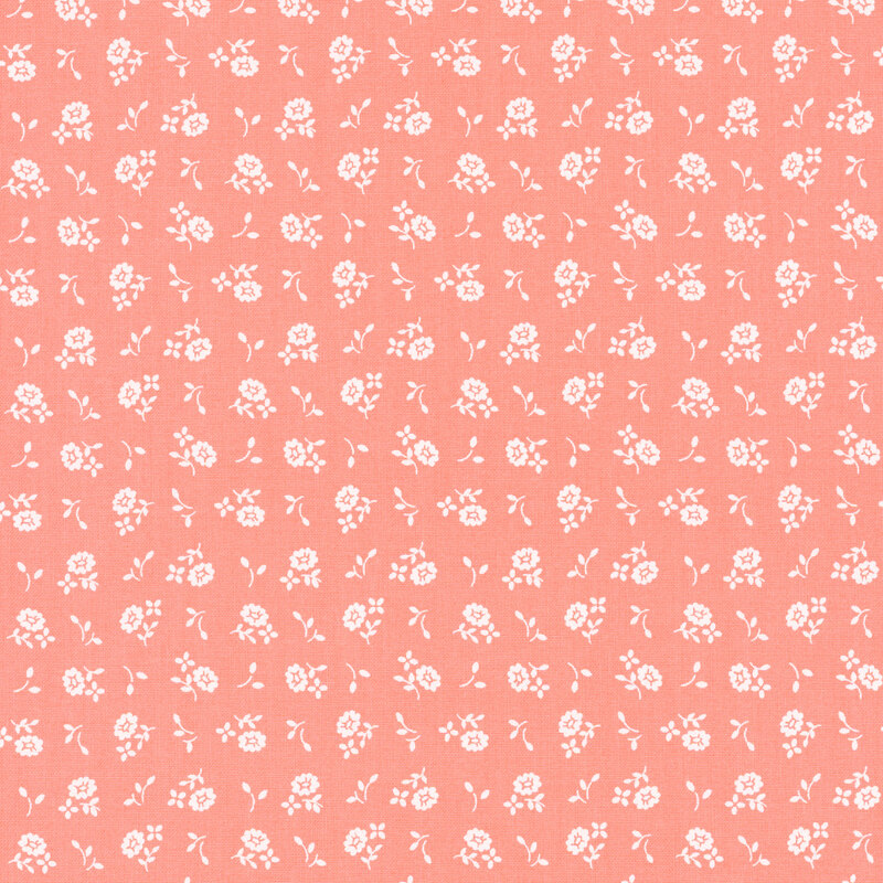 Pink fabric with small white ditsy flowers and sprigs throughout