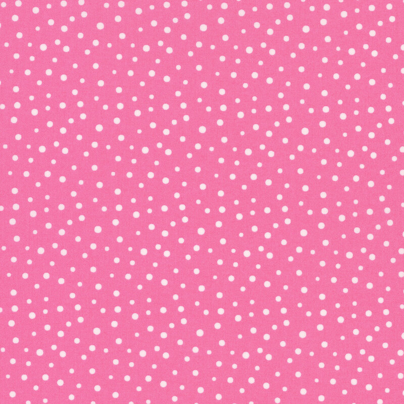 Bright pink fabric with small white polka dots of varying sizes throughout