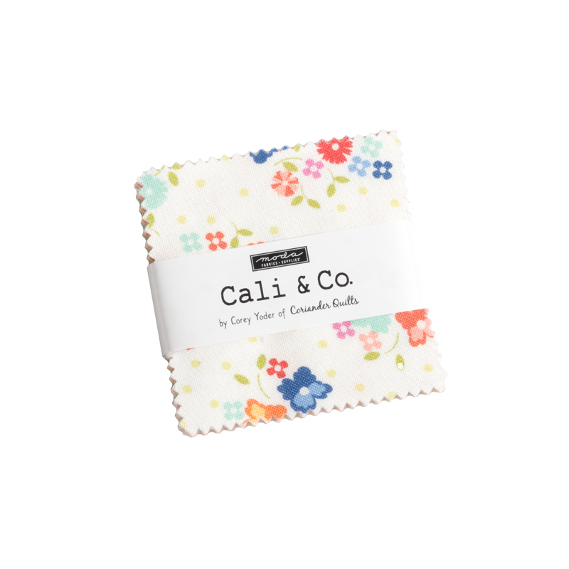 A square stack of fabrics with a ruler label wrapped around it and a Moda - Cali & Co. logo