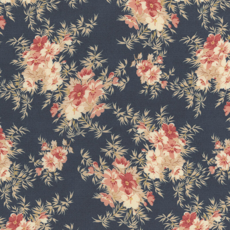 blue fabric with pink flowers and bushy leaves