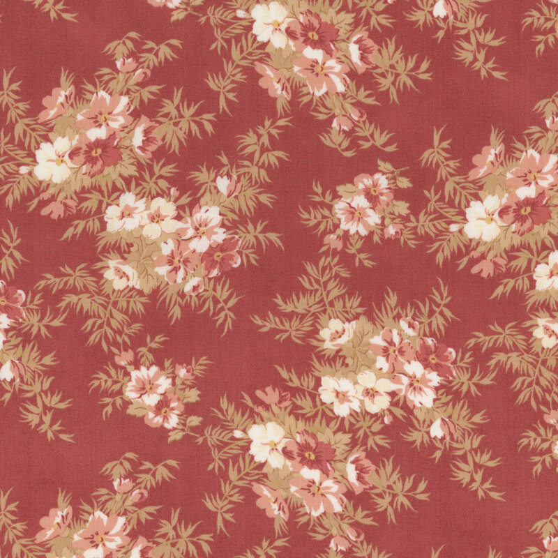 red fabric with pink flowers and bushy leaves