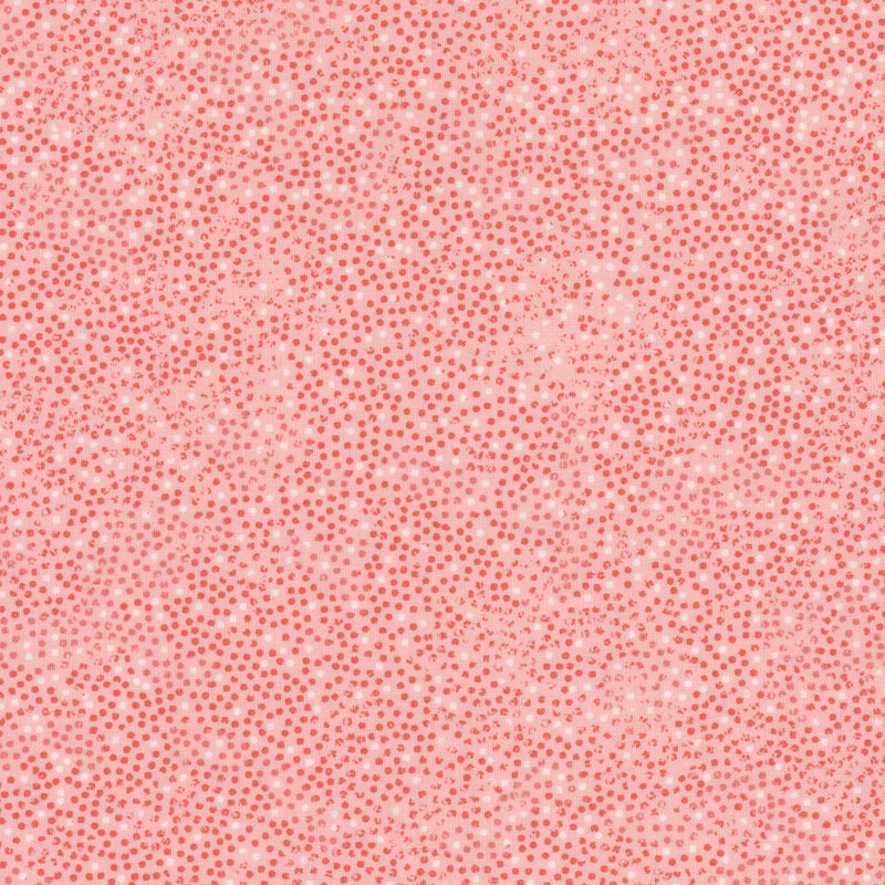 pink fabric with small red and white dots