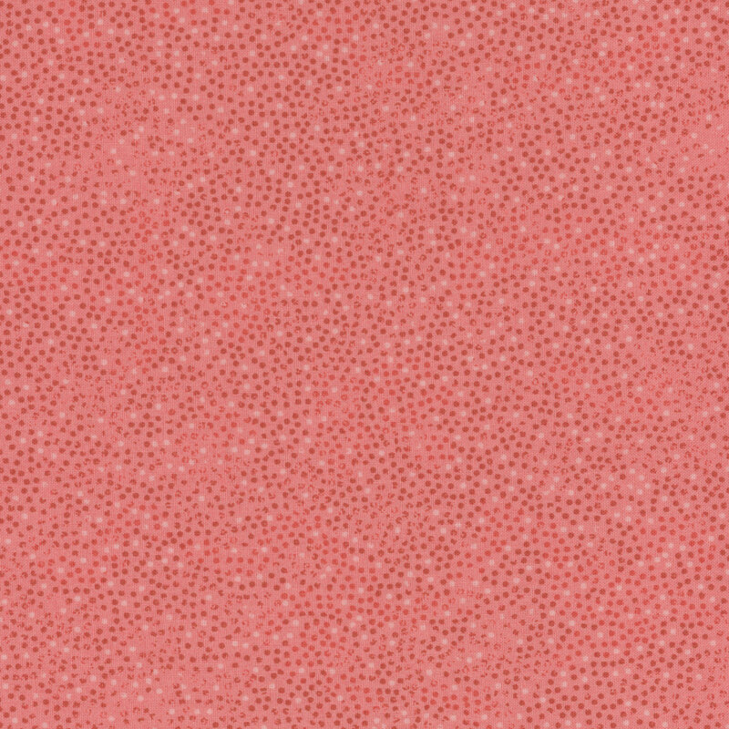 blush pink fabric with small red and white dots