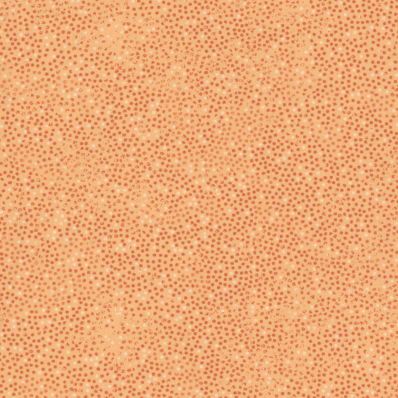 light orange fabric with small orange and white dots