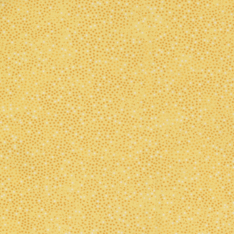 yellow fabric with small gold and white dots