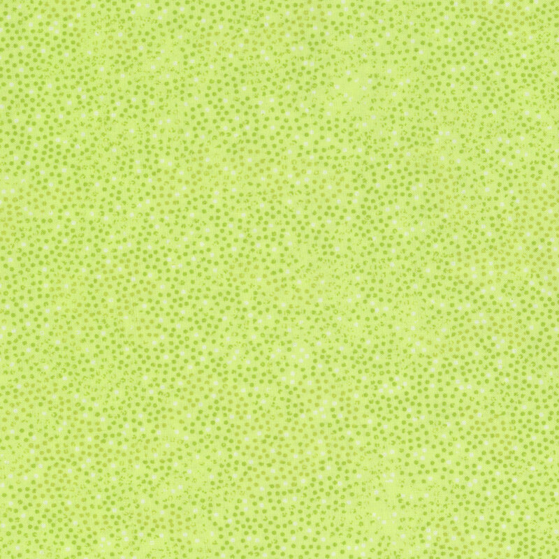 lime green fabric with small green and white dots