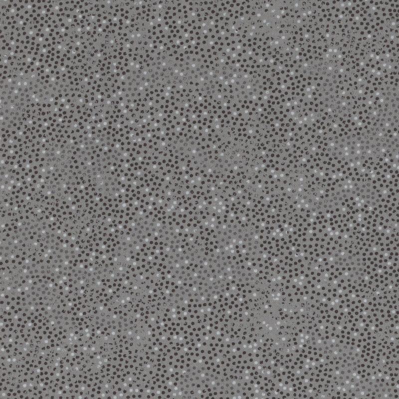 dark gray fabric with small black and white dots
